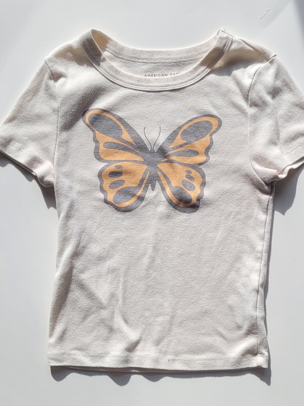 American Eagle Outfitters Cream Fitted Baby Tee with Yellow Butterfly